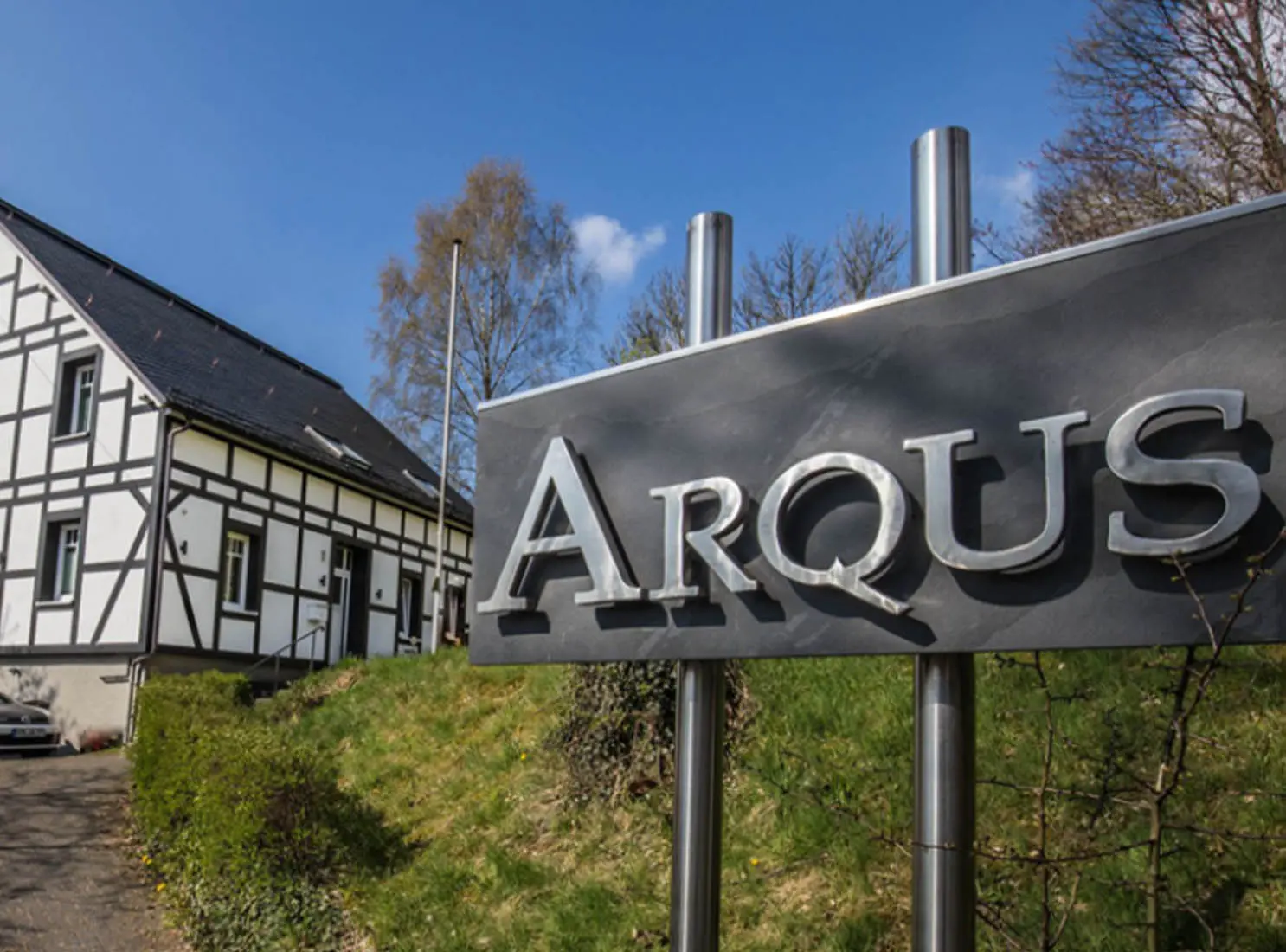 Arqus Firmenschild